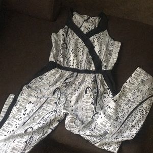 Jumpsuit with zip side and side pockets.